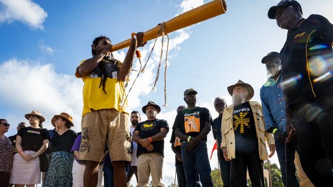 A Yolngu man plays the Yidaki (Didgeridoo) before presenting Indigenous Australian and activist Noel Pearson with a message stick during Garma Festival 2022 at Gulkula on Sunday. Picture: Tamati Smith/Getty Images