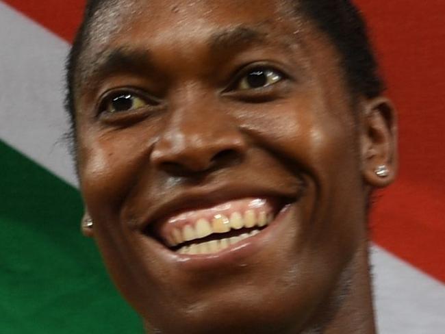 (FILES) In this file photo taken on April 13, 2018 South Africa's Caster Semenya celebrates with South Africa's flag after winning the athletics women's 800m final during the 2018 Gold Coast Commonwealth Games at the Carrara Stadium on the Gold Coast. South African Olympic champion Caster Semenya will go to court to challenge controversial new rules governing female athletes' testosterone levels, her lawyers said on June 18, 2018.  / AFP PHOTO / SAEED KHAN