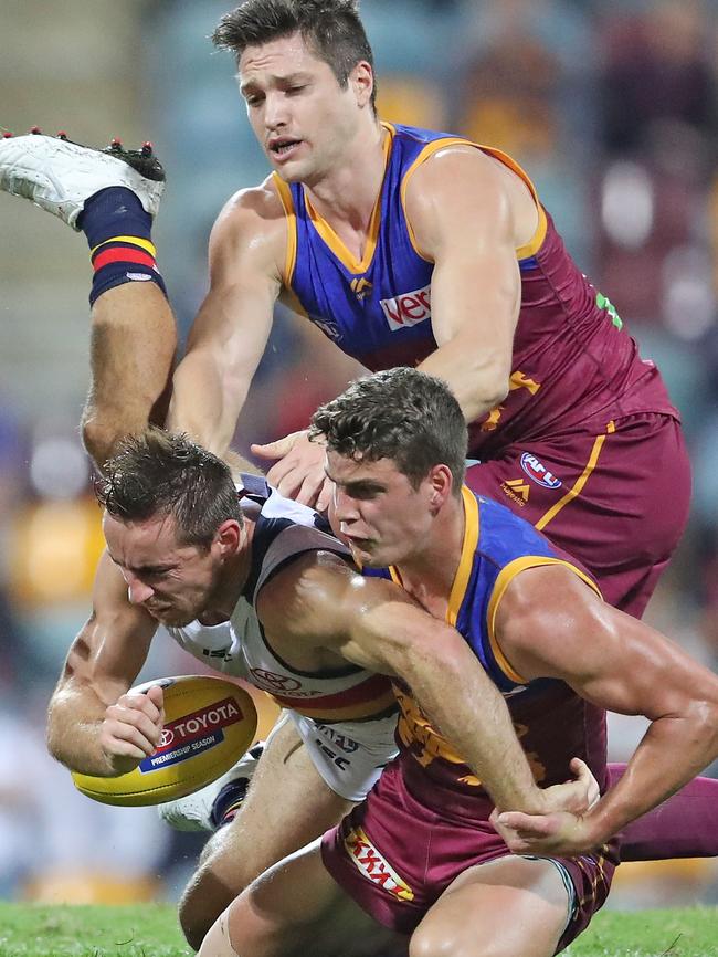 Richard Douglas crashes to the Gabba turf.