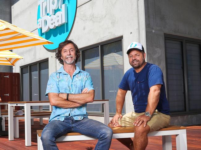 From left, co-founders Richard Johnston and Norm Black outside the TripADeal headquarters in Byron Bay.