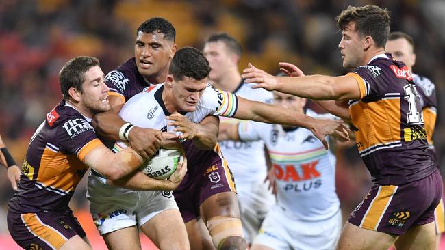 Nathan Cleary (centre) of the Panthers is tackled by Andrew McCullough (left) and Tevita Pangai Junior (2nd from left ) and Patrick Carrigan (right) of the Broncos during the Round 22 NRL match between the Brisbane Broncos and the Penrith Panthers at Suncorp Stadium in Brisbane, Friday, August 16, 2019. (AAP Image/Darren England) NO ARCHIVING, EDITORIAL USE ONLY