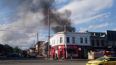 Smoke billowing from the North Melbourne bar. Picture: David Aidone.