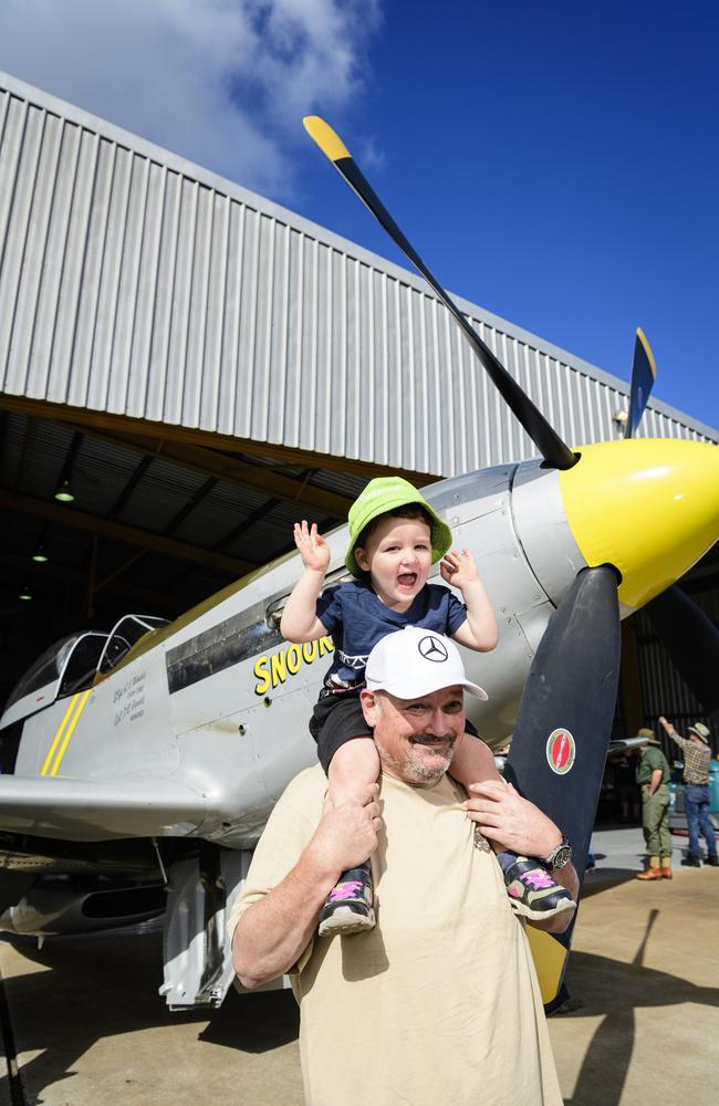 Vance Dean gets a good look at the P-51 Mustang WWII fighter from the shoulders of uncle Craig Scotts at the David Hack Classic, Sunday, May 18, 2025. Picture: Kevin Farmer