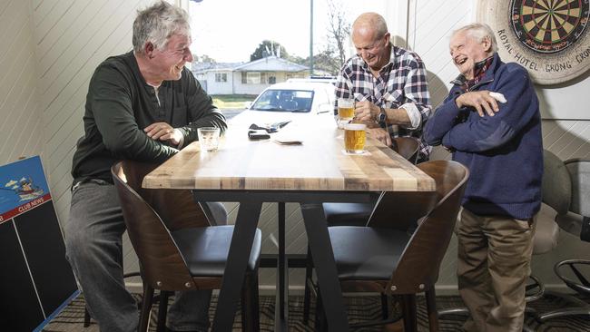 Mark Dixon, 60, Gary Powell, 69, and Peter Royale, 97, have a beer at the Grong Grong pub. Picture: Gary Ramage