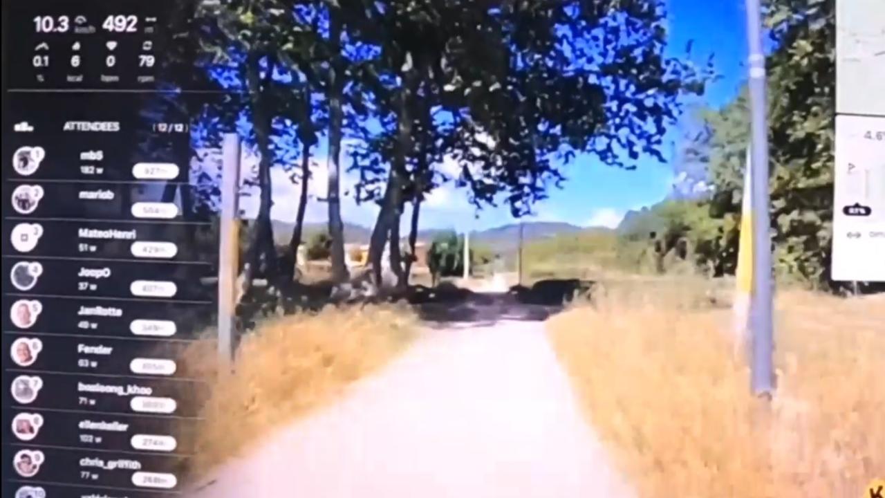 Cycling along a dirt track in Catalonia, Spain, using the Kinomap app on a smart trainer.