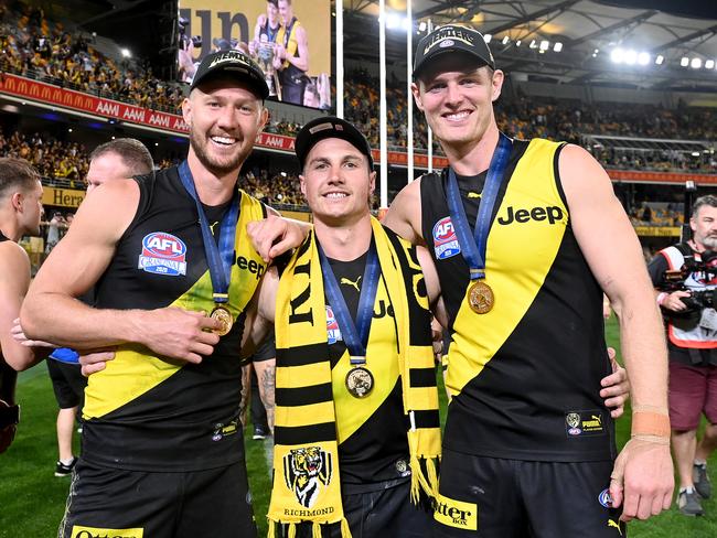 Broad with former teammates Liam Baker and David Astbury after the 2020 Grand Final.