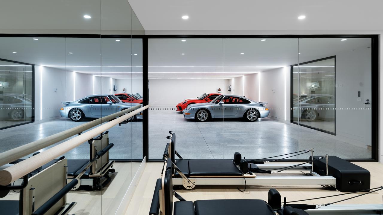 The seven-car basement garage would suit James Bond, and doubles as a luxury showroom adjoining a private gym and steam room for wellness without leaving home.