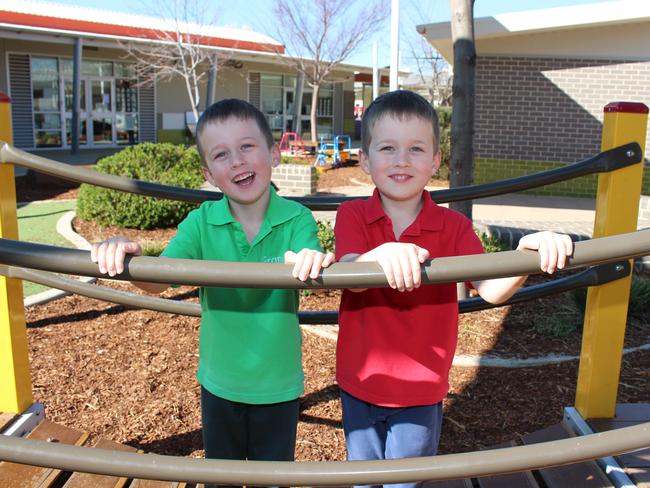 Franklin Early Childhood School principal Kate Flynn and twin students Micah (green shirt) and Levi (red shirt).