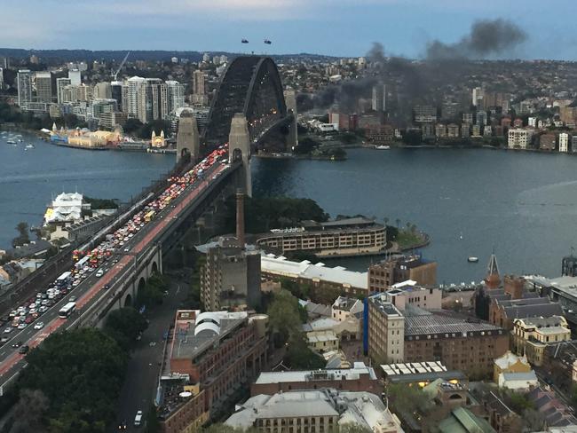 Smoke seen from a bus blaze on the Sydney Harbour Bridge, in Sydney, Thursday, Sept. 15, 2016. (AAP Image/Lauren Farrow) NO ARCHIVING