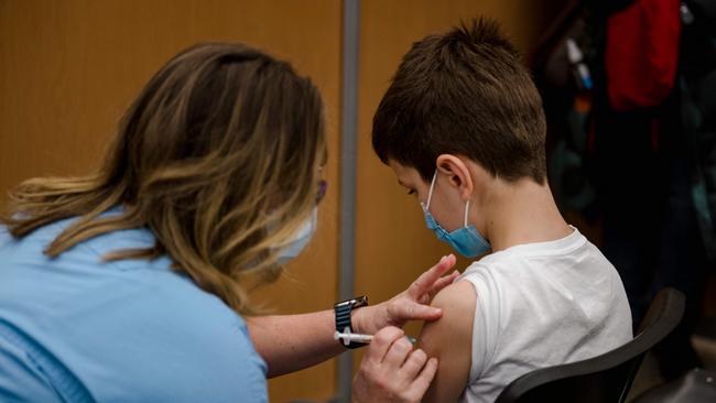 A child, 11, receives the Pfizer-BioNTech Covid-19 vaccine for children in Montreal. Picture: Andrej Ivanov/AFP