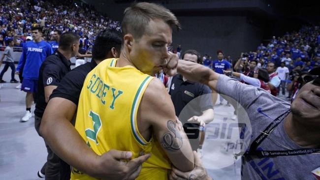 Sobey is punched in the face by the man in Philippines team uniform.