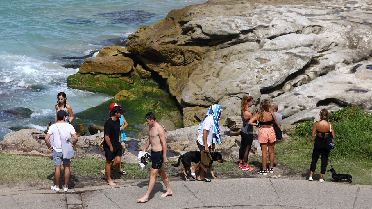 The beach was packed despite it being closed.