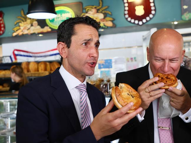 Brisbane, 10 January 2025. Queensland Premier David Crisafulli and Minister for Customer Services Steve Minnikin enjoy a pie from Uncle Bobs Bakery in Belmont during a press conference in Brisbane. Picture: Tertius Pickard - Supplied