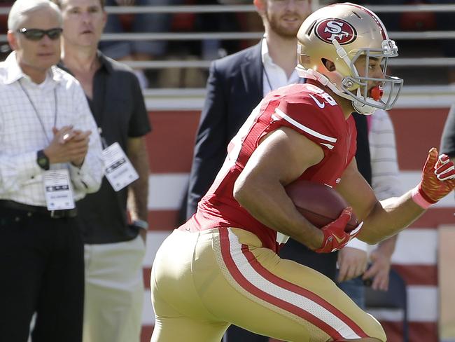 Jarryd Hayne returns a punt against the Green Bay Packers.