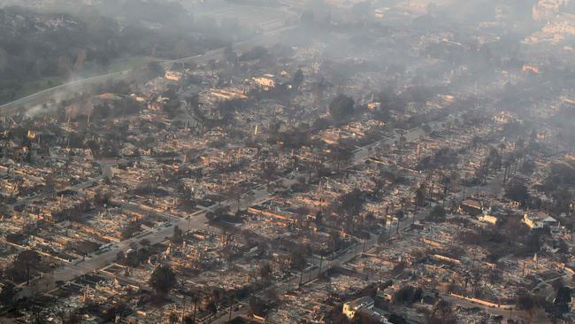 In this aerial view taken from a helicopter, burned homes are seen from above during the Palisades fire near the Pacific Palisades neighbourhood. Picture: AFP