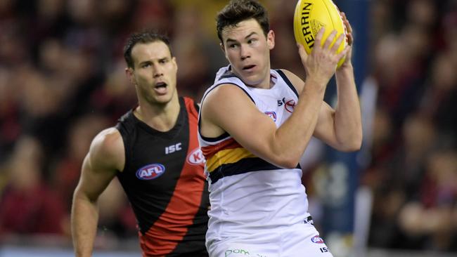 Mitch McGovern gathers in front of Matt Dea.