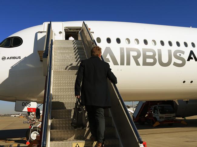 The new Airbus A350 XWB jet pictured in Sydney during a stop over on a round-the-world test flight. Journalist Scott Rochfort climbs the stairs to board the plane. Picture: Toby Zerna