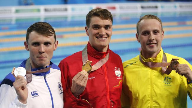 Men's 200m breaststroke gold medallist James Wilby, centre, with silver medallist Ross Murdoch, left, and bronze medallist Matt Wilson. Photo: AP