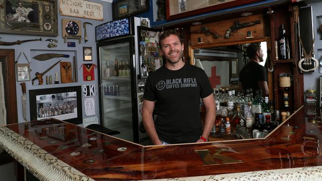 The bar is countersunk with about 60 challenge coins — a medallion bearing a military unit’s insignia or emblem. Picture: Gary Ramage