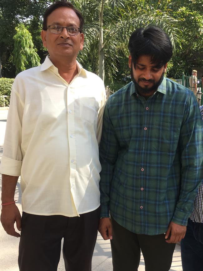 Puneet’s father, left, with Puneet Puneet outside court in India.