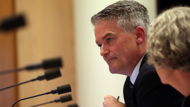 Senator Mathias Cormann with Deputy Secretary Stephanie Foster during Senate Estimates in Parliament House in Canberra. Picture Gary Ramage