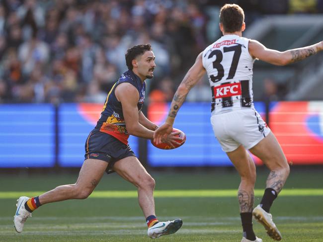 MELBOURNE, AUSTRALIA - MAY 18: Izak Rankine of the Crows in action during the 2024 AFL Round 10 match between The Collingwood Magpies and Kuwarna (Adelaide Crows) at The Melbourne Cricket Ground on May 18, 2024 in Melbourne, Australia. (Photo by Dylan Burns/AFL Photos via Getty Images)