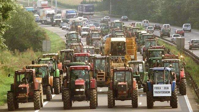 French farmers drive their trucks on the highway near Strasbourg, eastern France during a demonstration against high fuel prices in 2000.