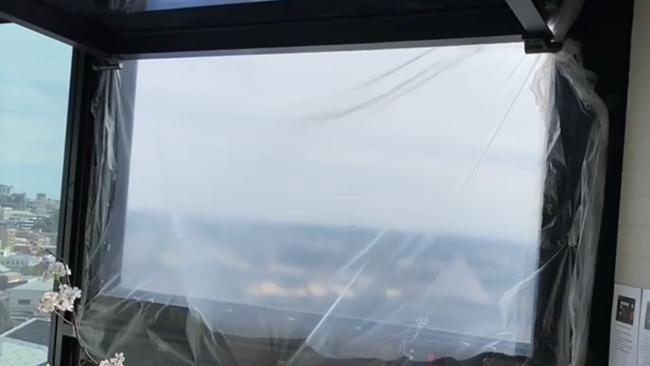 The window hole in a Perth Airbnb on the 16th floor of an apartment building in the CBD was replaced with a sheet of plastic. Picture: Reddit