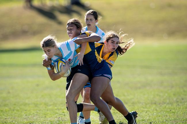 Amelia Whitaker (with the ball in hand). Picture: Julian Andrews