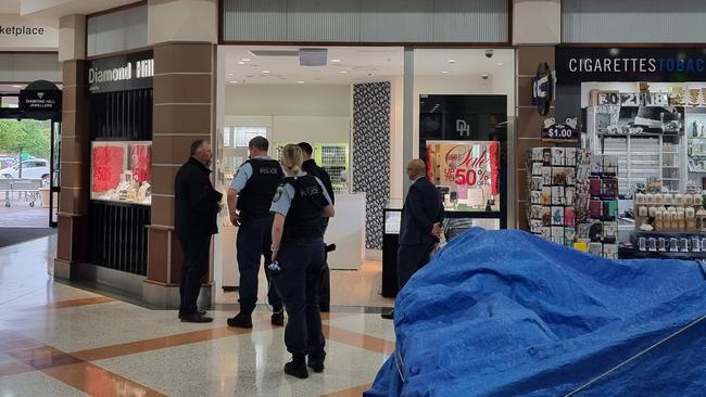 Police at the crime scene at the jewellery store.