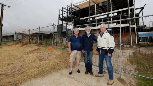 Carrickalinga Ratepayers Association members John Lawrence, David Catherwood and Chris Mather outside the controversial property at 9 Gold Coast Drive, Carrickalinga. Picture: Dylan Coker