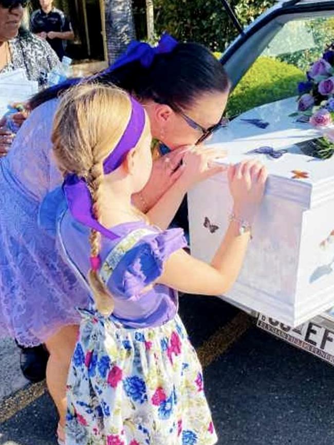 Saasha and Arianna, Jessica's daughter, saying goodbye at her funeral.