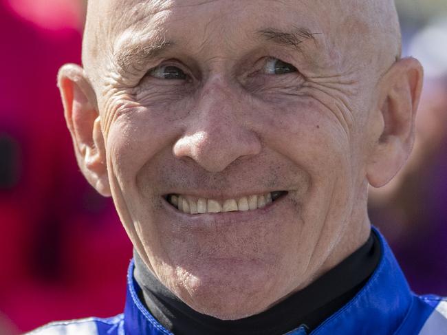 Jockey Jeff Lloyd is seen celebrating his retirement with the other Brisbane jockeys during the Brisbane Racing Club Race Day at Doomben Racecourse in Brisbane, Saturday, July 13, 2019.  (AAP Image/Glenn Hunt) NO ARCHIVING, EDITORIAL USE ONLY