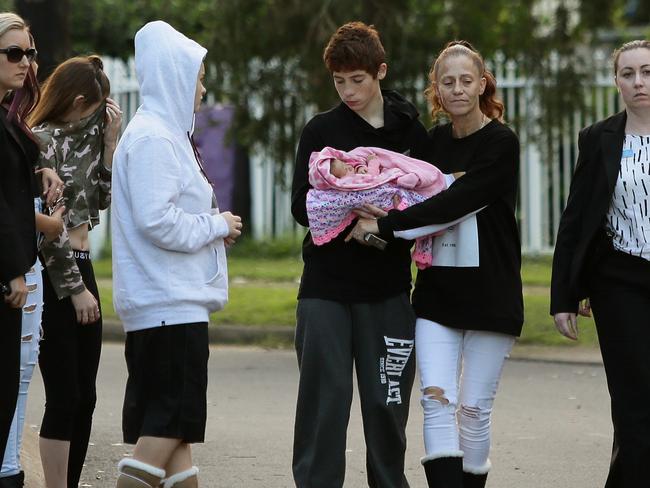 Jayden Lavender holds his baby girl as his girlfriend Jenifer Morrison (left) looks on. Picture: Justin Sanson