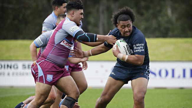 Tuni Taualii from Chifley College stries to find a way through the Hills Sports defence. Picture: Adam Yip