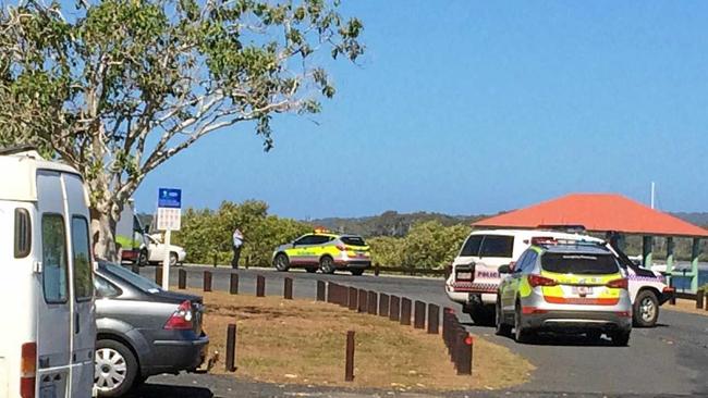 Ambulances attend the scene of a water incident at Tin Can Bay involving a man and a child. Picture: Donna Jones