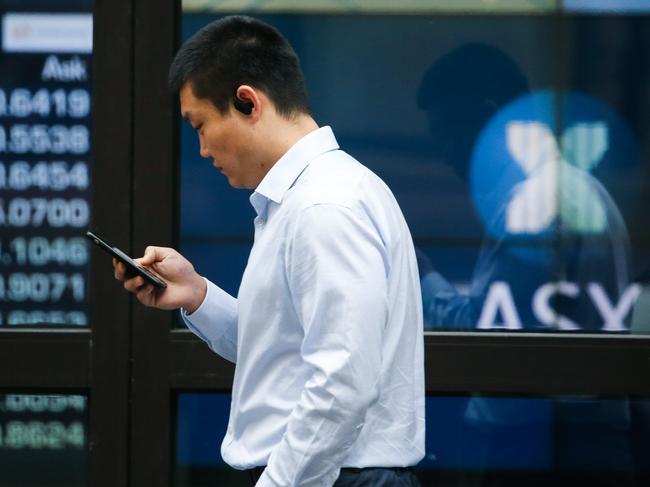 SYDNEY, AUSTRALIA - Newswire Photos October 31, 2022: Members of the public are seen walking past the ASX in Sydney. Picture: NCA Newswire / Gaye Gerard