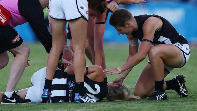 Kate Sheahan is consoled by teammate Emma Grant after injuring her knee. Picture: Michael Klein