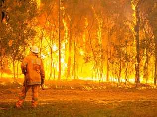 FIREWALL: QFES shared this harrowing image that shows just what firefighters are up against.