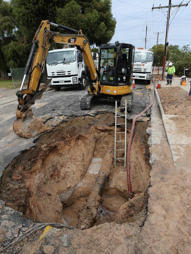 Damage to homes after a water main burst at Secombe Gardens, SA.