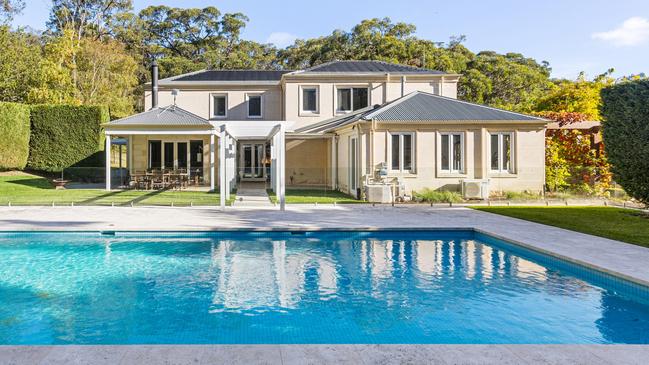 The pool is surrounded by greenery.