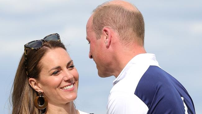 WINDSOR, ENGLAND - JULY 06: Prince William, Duke of Cambridge and Catherine, Duchess of Cambridge embrace after the Royal Charity Polo Cup 2022 at Guards Polo Club during the Outsourcing Inc. Royal Polo Cup at Guards Polo Club, Flemish Farm on July 06, 2022 in Windsor, England. (Photo by Chris Jackson/Getty Images for TLA Worldwide)