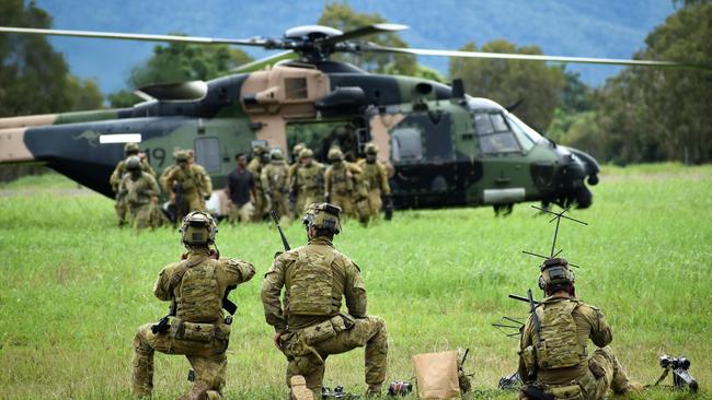 Australian Army soldiers disembark from an Army MRH90 Taipan from Townsville’s 5th Aviation Regiment. Picture: Cameron Bates