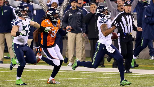 Harvin #11 running 87-yards to score a touchdown against the Denver Broncos in the third quarter during Super Bowl XLVIII.