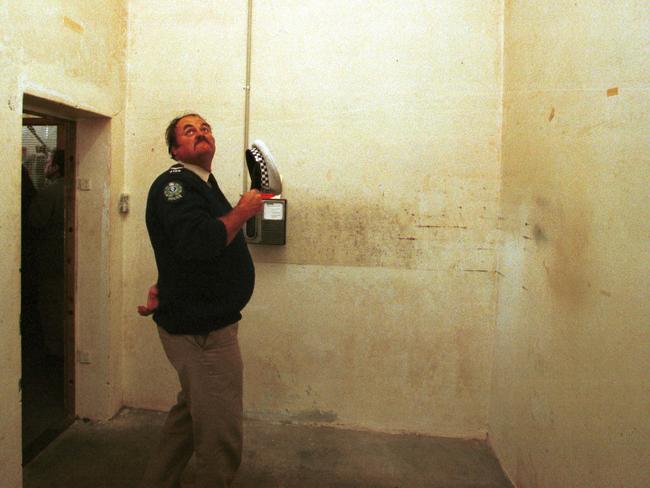 A police officer in the Snowtown bank vault where eight bodies found in acid-filled drums. Picture: File