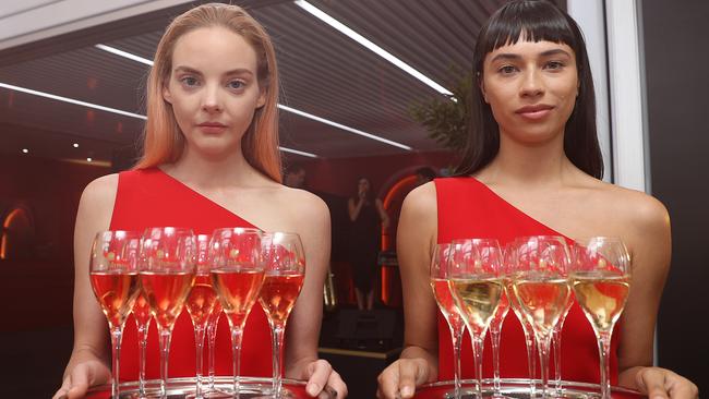 Waitresses handing out glasses of Mumm. Picture: Getty