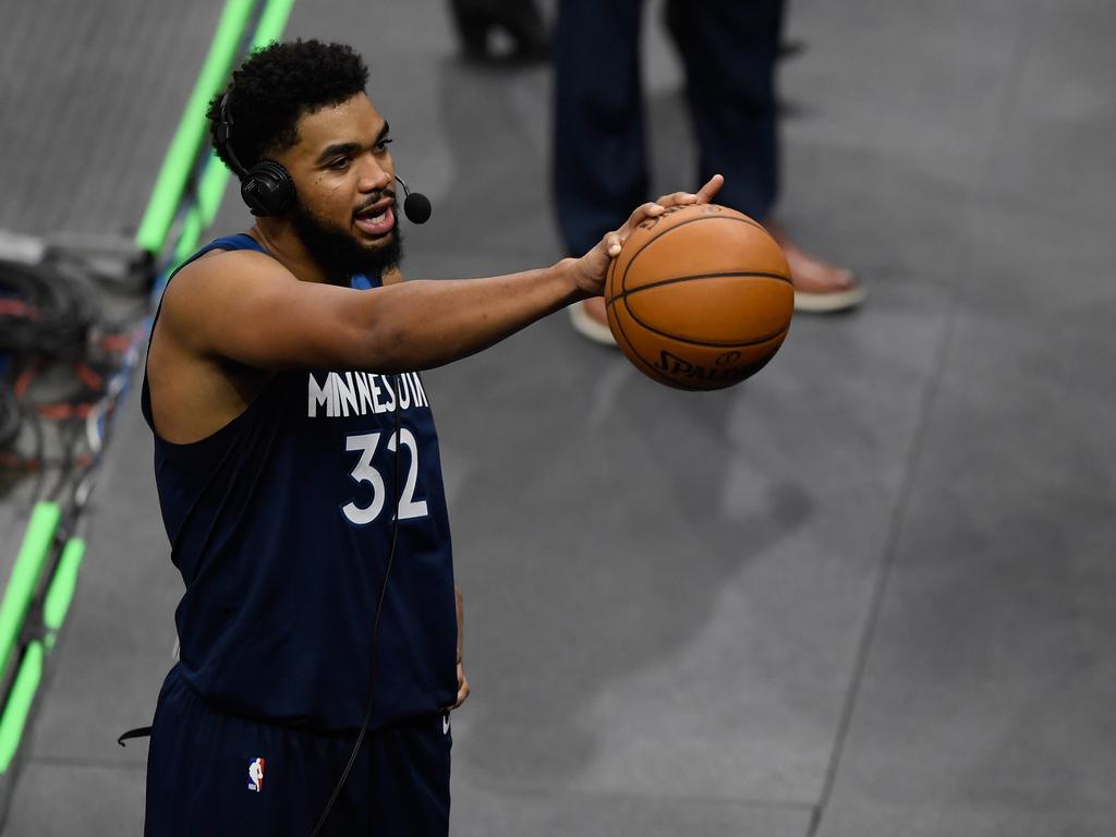 Karl-Anthony Towns dedicates the game ball to his mum.