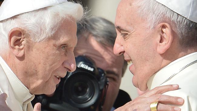 Benedict is welcomed by Pope Francis as he arrives to attend a papal mass for elderly people on St Peter's Square at The Vatican. Picture: AFP