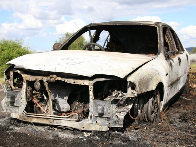 A woman was lucky to escape uninjured after her car burst into flames on Malar Road at Booie. Photo: Holly Cormack