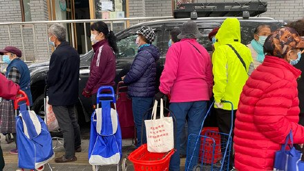 Shoppers wait in line outside a store in China. Picture: Supplied